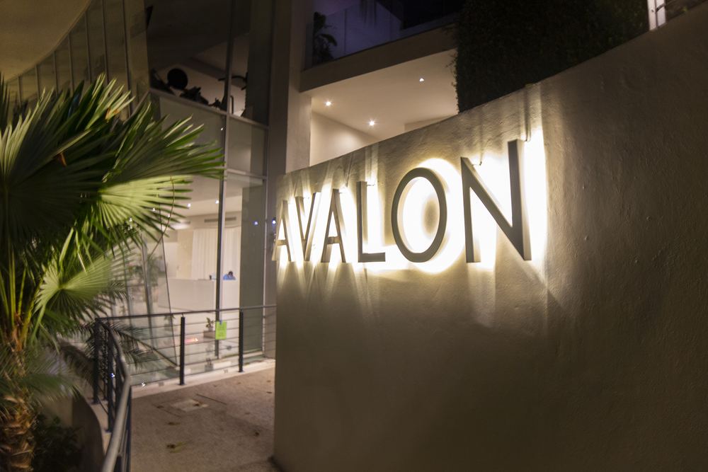 Illuminated Avalon sign at night