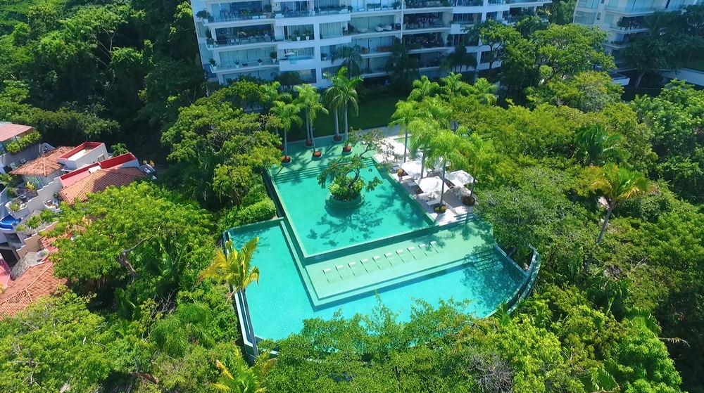 Aerial drone view of the pool and gardens
