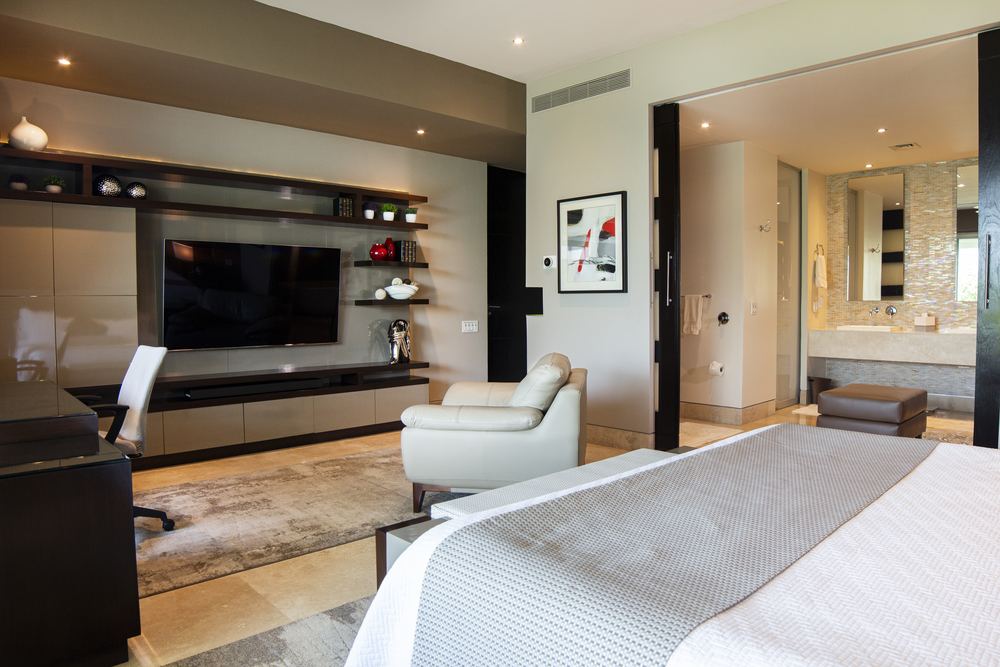 Master bedroom entertainment center and open bath
